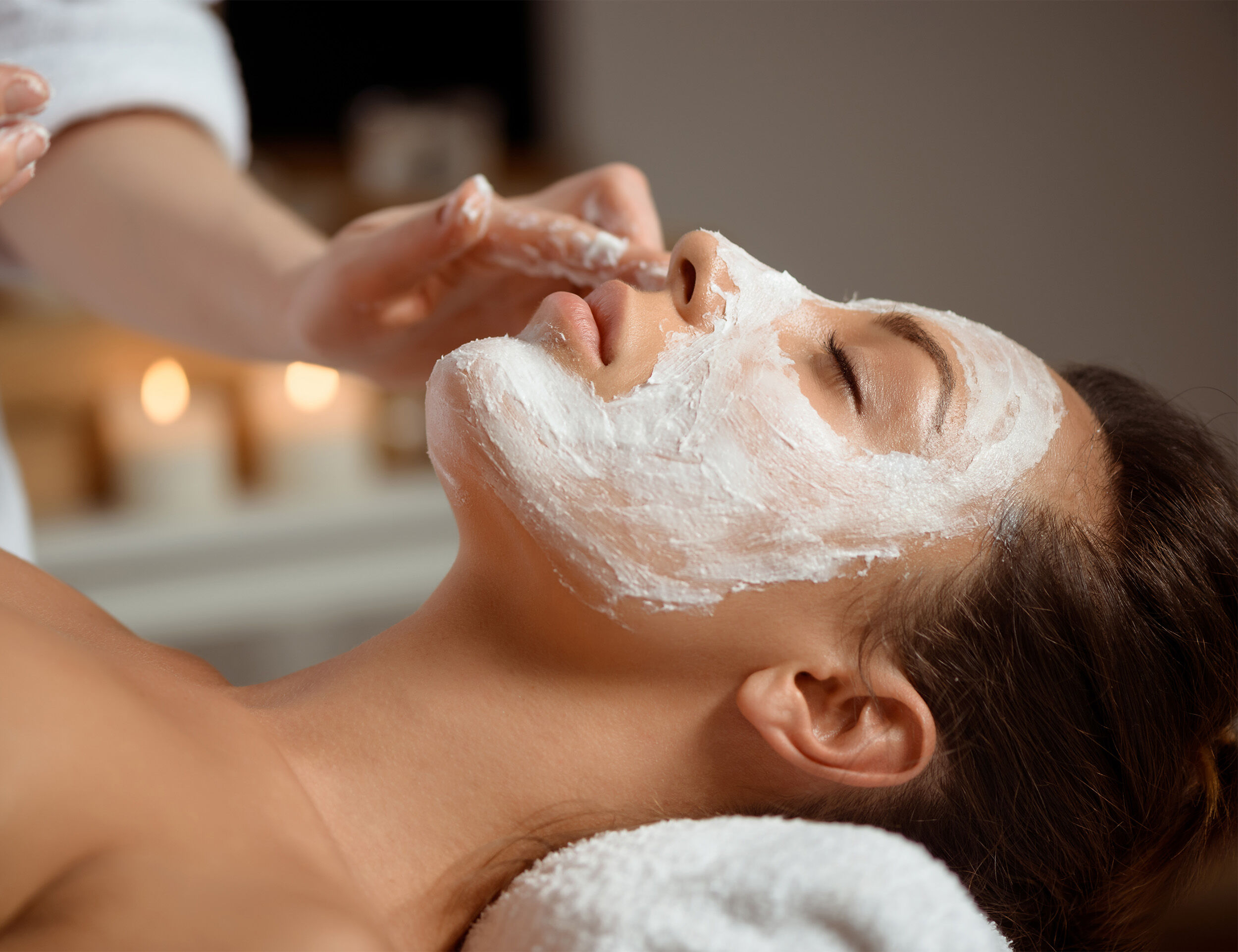 bride getting skin care done by a sckin care specialist